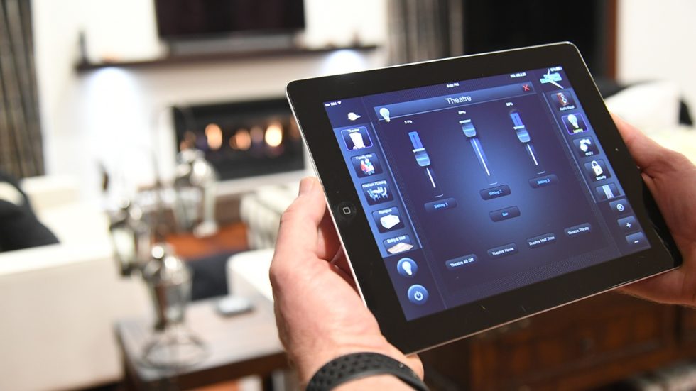 Model using an iPad to control systems in a smart home