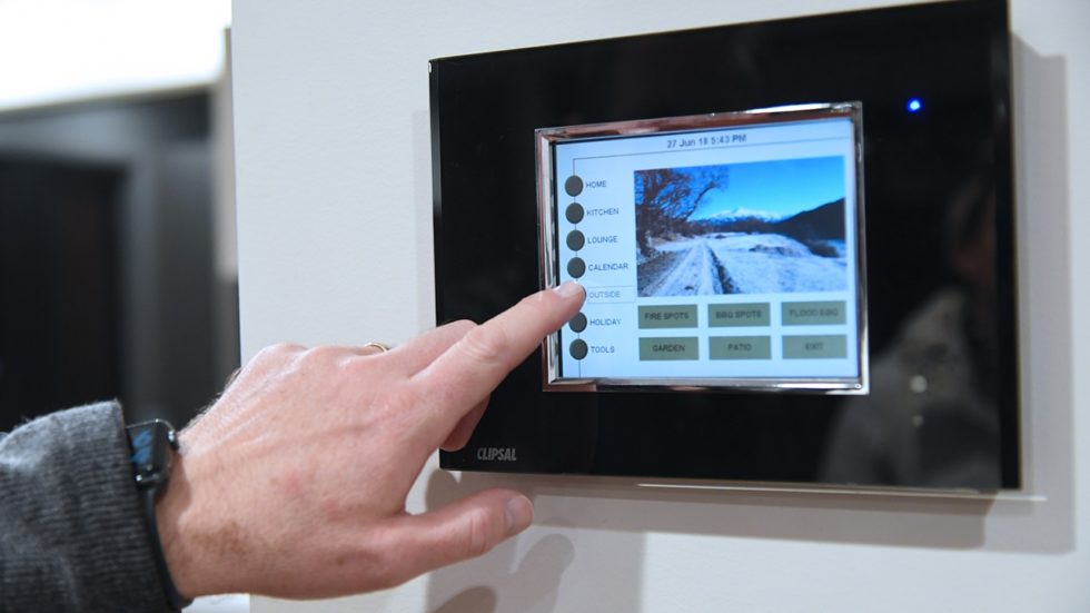 Model using touch screen to change lighting configuration