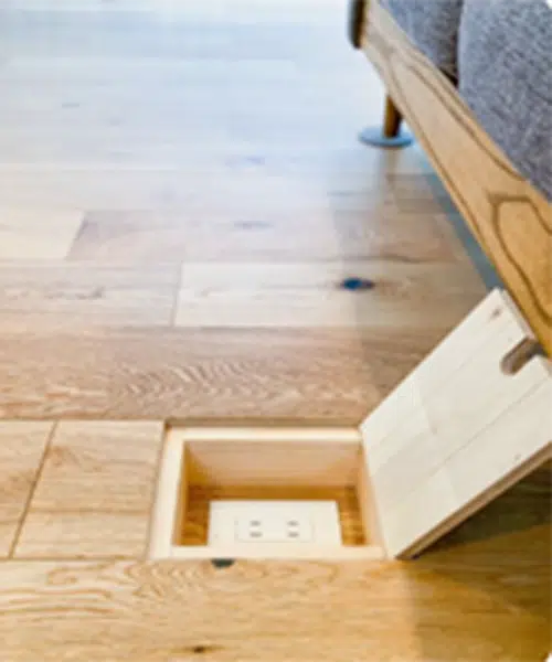 hidden power outlet in floorboards