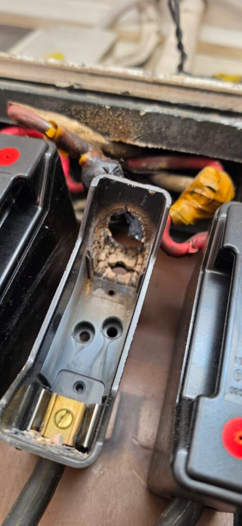 Scorched socket and damaged appliance lead found during test and tag